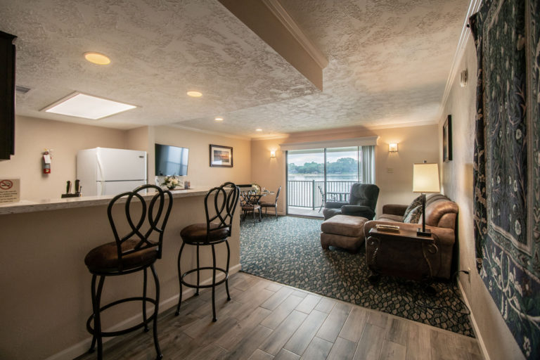 Photo of kitchen with living room. Unit 125